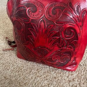 Red tooled leather backpack